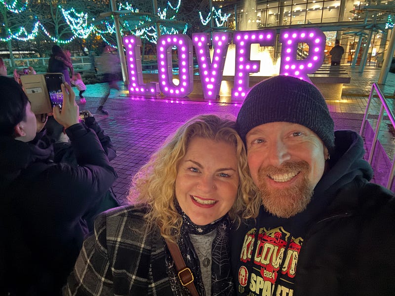 Jen and Andrew at an Eras Tour themed installation in Vancouver