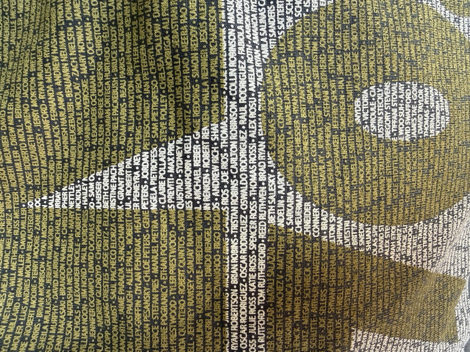 The IRONMAN event shirt printed with athletes' names, mine (Andrew Rich) in the center