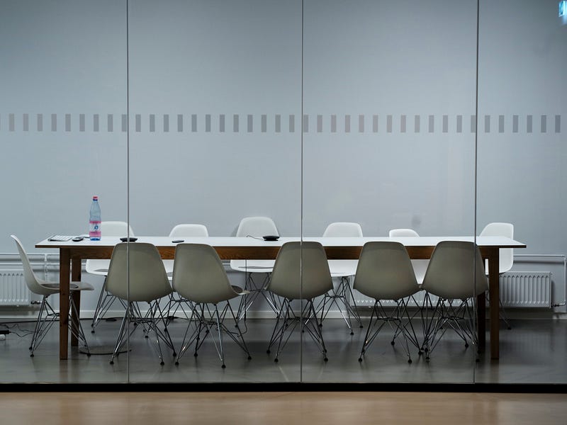Empty corporate conference room with chairs