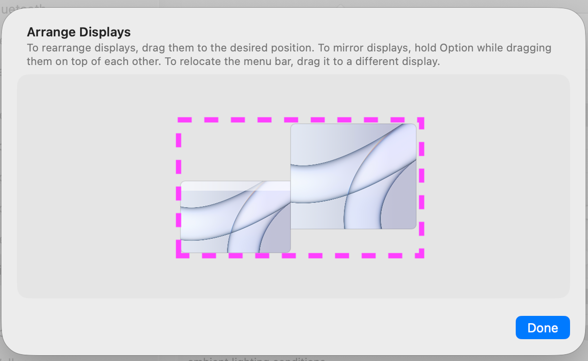 macOS Display Arrangement for the work MacBook Pro with its three displays